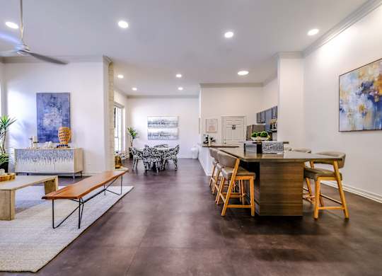 social lounge with a kitchen, comfortable seating and plenty of conversation areas at San Marin apartments