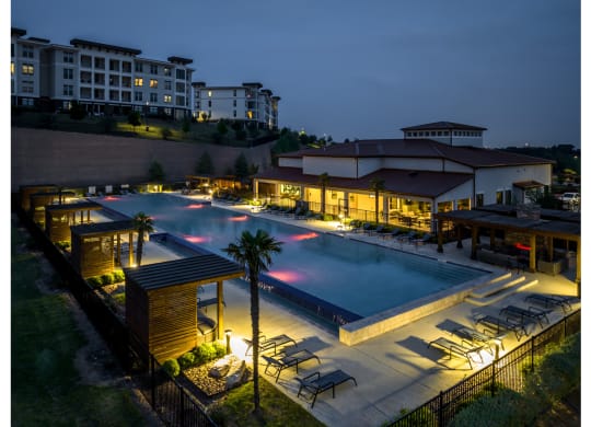 evening view of the swimming pool at Reveal Skyline apartments