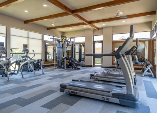 fitness center with cardio equipment at The Pradera apartments