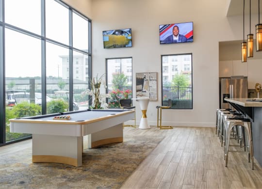 social lounge with billiards at Reveal Skyline apartments