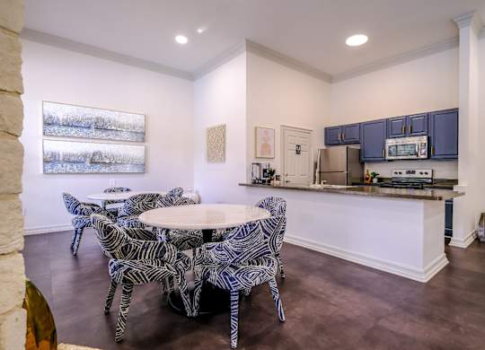resident social area with a kitchen and dining area at San Marin apartments