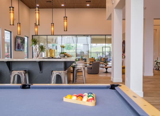 social lounge with billiards at Reveal Skyline apartments