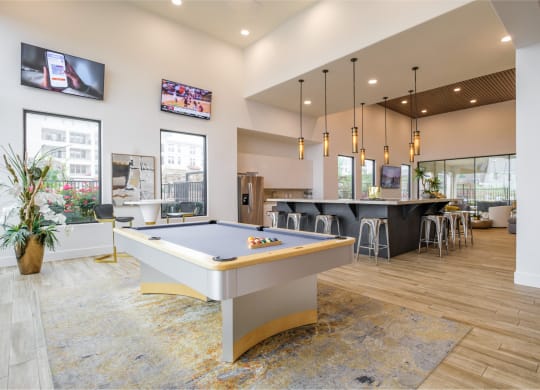 social lounge with billiards at Reveal Skyline apartments