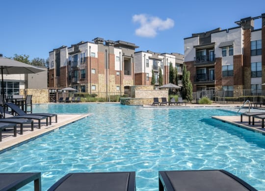 resort-inspired swimming pool at Soho Parkway apartments