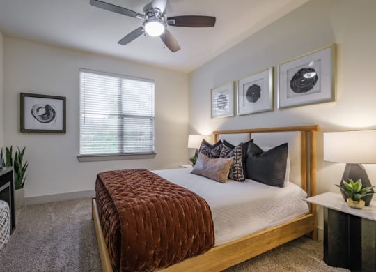 luxury bedroom with ceiling fan at Berkshire Medical District apartments