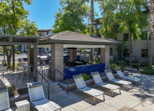 poolside lounging areas at Avora apartments