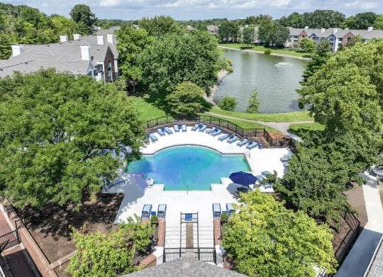 Aerial View of Pool and Lake at Sawmill Village Apartments
