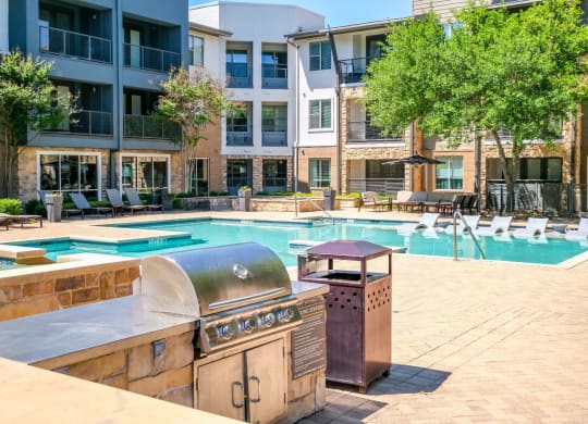 swimming pool and grilling area at Berkshire Medical District apartments