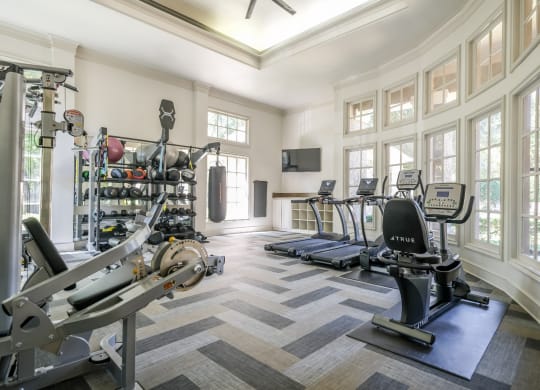 fitness center with free weights at Stoneleigh on Spring Creek apartments