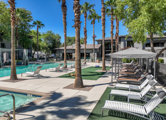 poolside lounging areas at Avora apartments