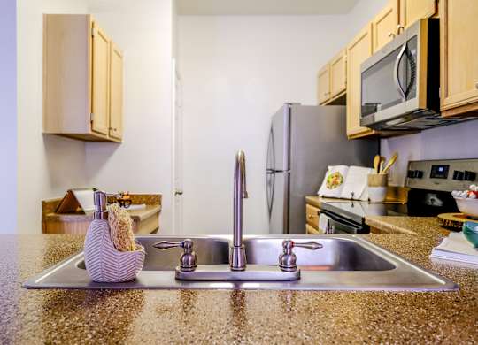 luxury kitchen with stainless steel appliances at San Marin apartments