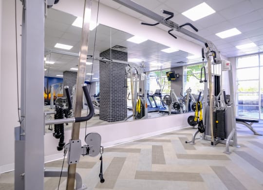 fitness center with weights and strength training equipment at Roosevelt Square apartments