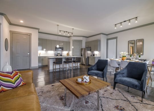 spacious, open-concept kitchen and living room at Reveal Skyline apartments