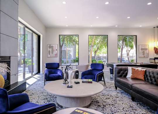social lounge with a fireplace at Avora apartments