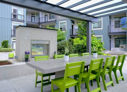 outdoor fireside dining and social area at Elan Redmond apartments