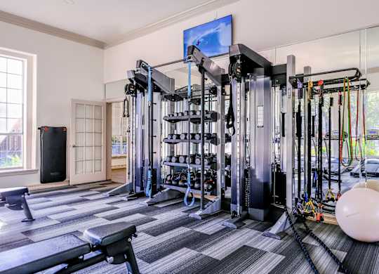 a fitness room with cardio equipment at San Marin apartments