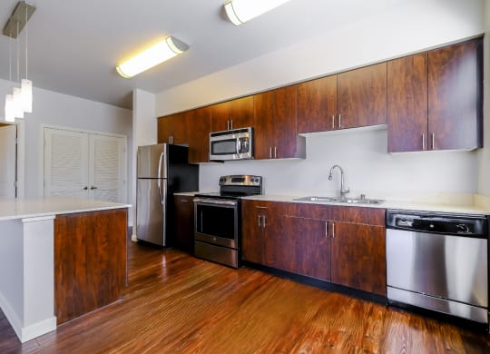 kitchen with stainless steel appliances and custom cabinetry at Elan Redmond luxury apartments