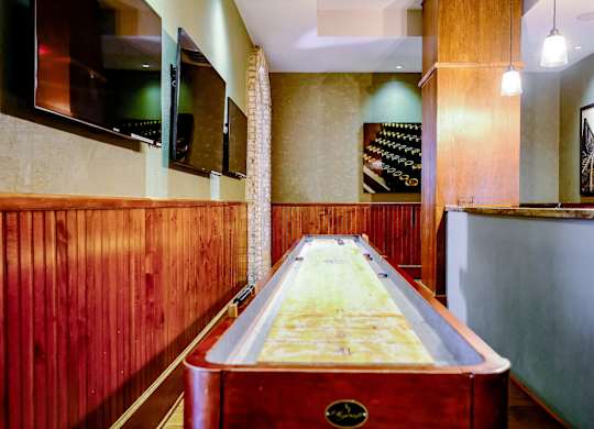 game room with shuffle board at Berkshire Village District apartments