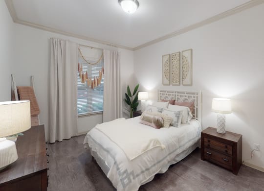 a bedroom with a bed and two night stands