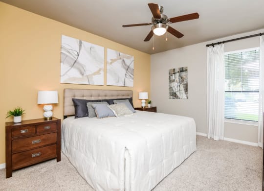 Falls at Eagle Creek apartments bedroom with ceiling fan