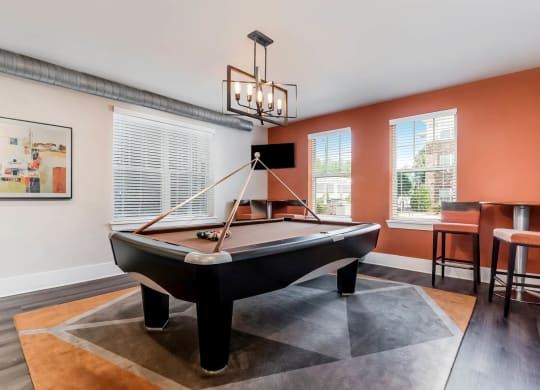 Village at Marquee Station apartments social area with billiards