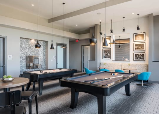 gaming lounge with billiards and shuffle board at Tinsley on the Park apartments