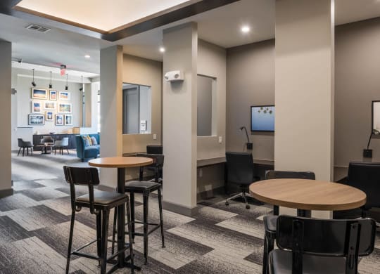 a lounge area with tables and chairs at Tinsley on the Park apartments