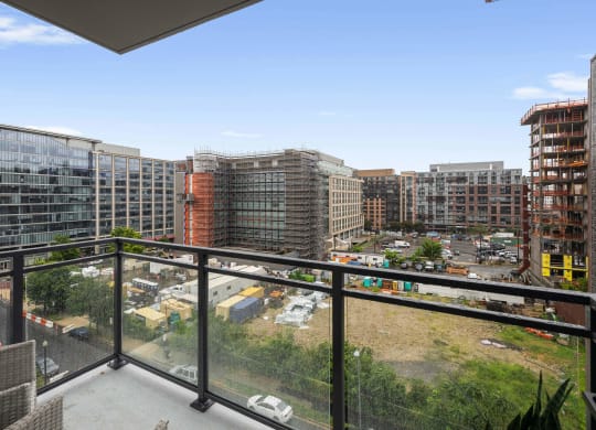 a balcony with a glass railing at Tribeca NOMA apartments