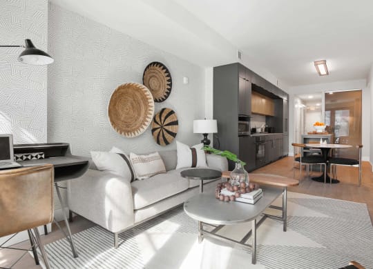 a unit with a living room with a couch and a table at Tribeca NOMA apartments