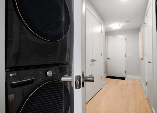 an in unit black washer and dryer at Tribeca NOMA apartments