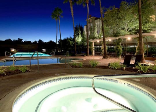 Hot tub with view of swimming pool nighttime photo at The Enclave CA, San Jose, 95134