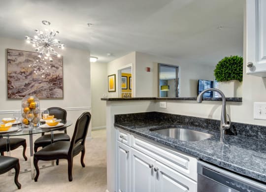 Kitchen with Granite Counters & Breakfast Bar at Ellington Metro West, Massachusetts, 01581