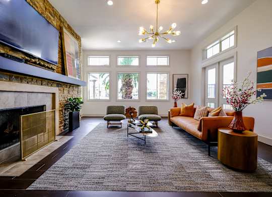 social lounge with a fireplace at The Falls at Copper Lake apartments