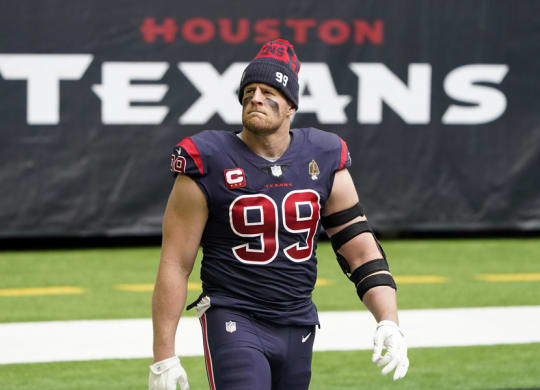 football player walks on the field before a game