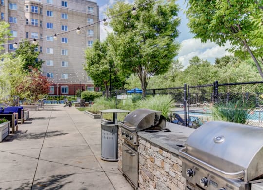 Outdoor Kitchen, BBQ, Living Green Space with Firepit and Outdoor Movies and Pool--HighPoint Apartments Quincy MA