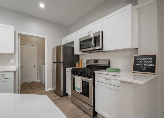 Kensington Grove apartments with with cabinets and stainless appliances