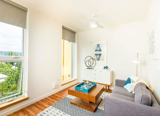 Living Room With Expansive Window at Lower Burnside Lofts, Portland