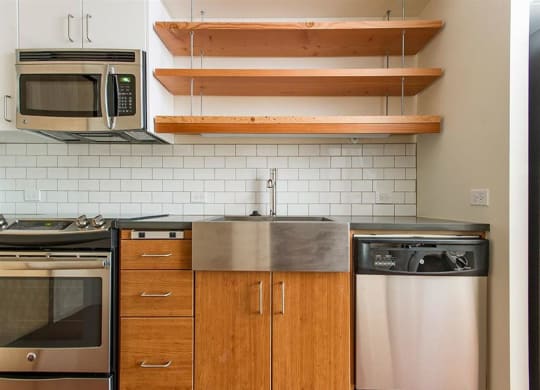 Fully Furnished Kitchen With Stainless Steel Appliances at Lower Burnside Lofts, Oregon