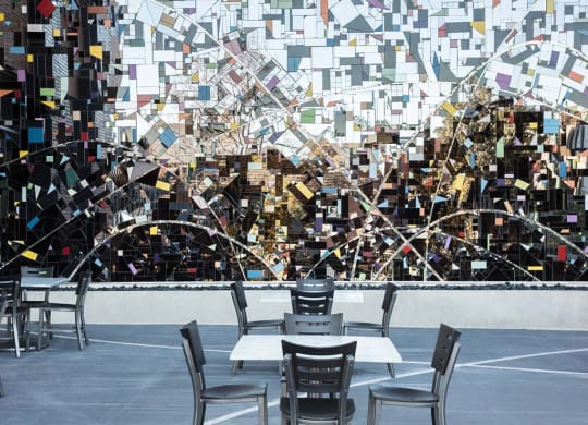 Outdoor art installation with chairs and cafe tables at Lyric, California