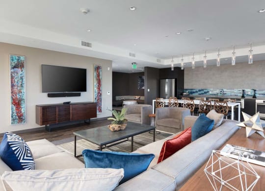 Common area with sofa and kitchen area at Lyric, California, 94596