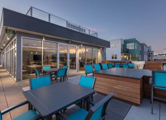 Common area rooftop deck table and chairs at Lyric, Walnut Creek, 94596