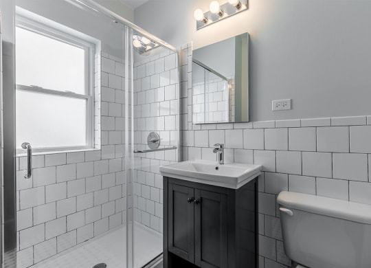 The Edison apartments bathroom with tile backslash
