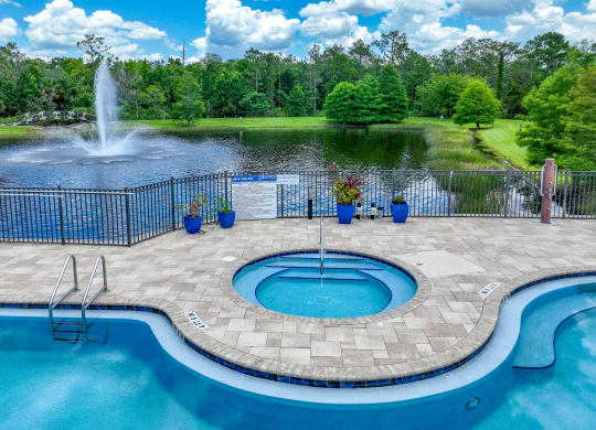 lakeside swimming pool at The Reserves at Alafaya apartments