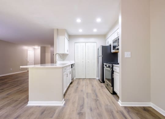 a kitchen with white cabinets