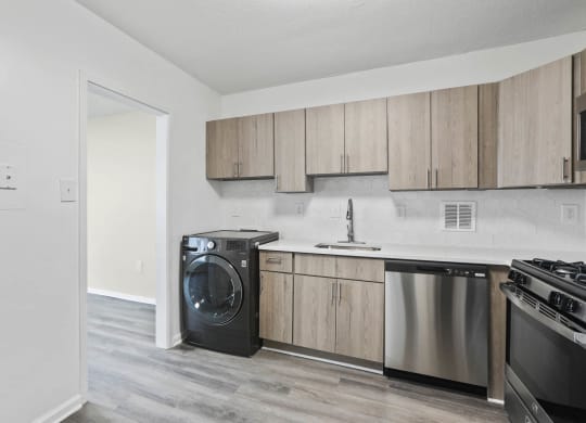 Skyline Towers apartments offer a modern kitchen with stainless steel kitchen appliances and wooden cabinets