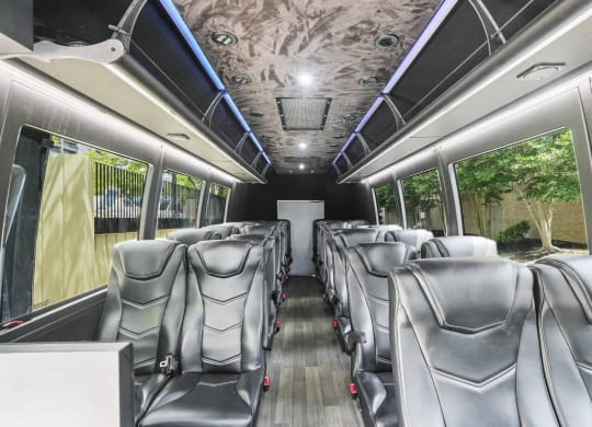 Skyline Towers apartments comfortable seating inside of a luxury shuttle bus