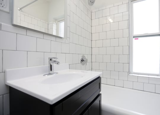 The Edison apartments bathroom with tile backsplash