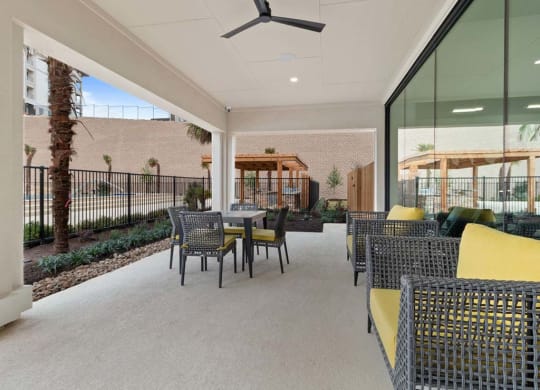 Living room with yellow sofa1 at Reveal Skyline  at La Cantera, San Antonio, 78256