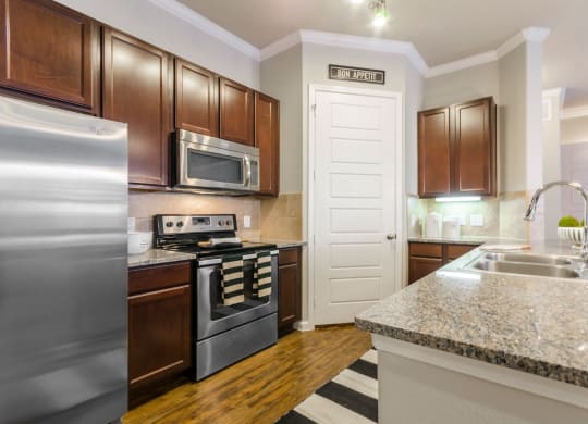 Kitchen with appliances and cupboards at Park 3Eighty, Texas, 76227