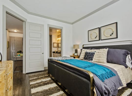 Bedroom with comfy bed at Reveal at Bayside, Rowlett, Texas